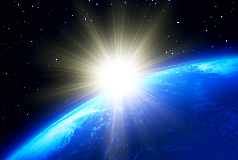 earth with shining sun radiating by it
